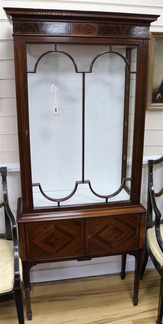 An Edwardian straight front cabinet H.165cm